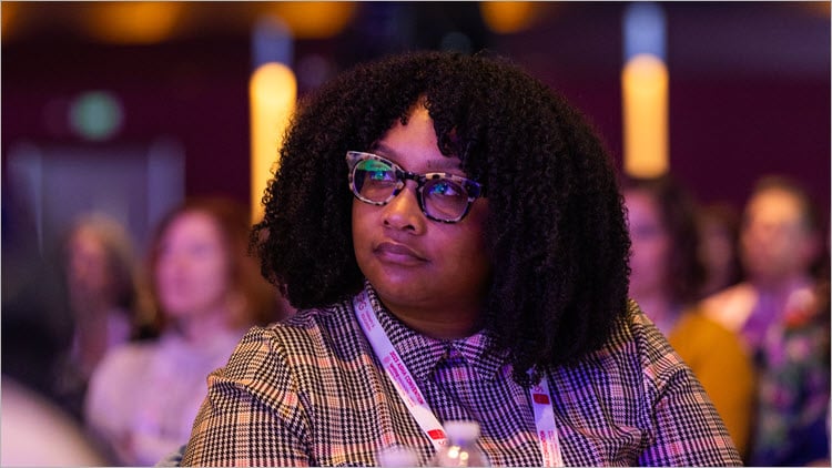 An attendee at the Opening General Session